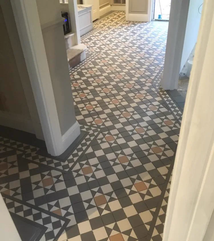 Grey and terracotta geometric Victorian floor tiles in a period Sussex hallway, Banks and Co Ceramics installation